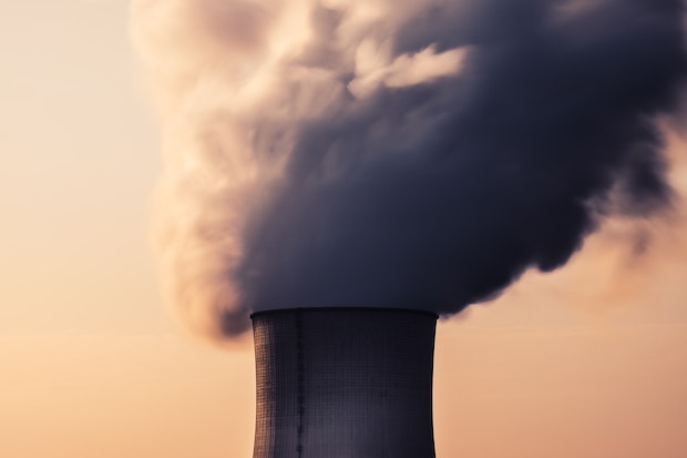A nuclear power plant's cooling towers, illustrating the EU debate over classifying nuclear energy as green